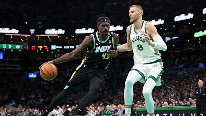 Jan 30, 2024; Boston, Massachusetts, USA; Indiana Pacers forward Pascal Siakam (43) drives to the basket vs. Boston Celtics center Kristaps Porzingis.