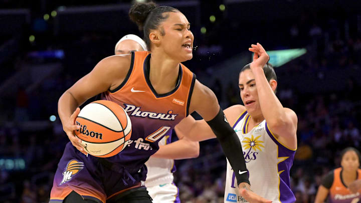 Aug 26, 2025; Los Angeles, California, USA;  Phoenix Mercury forward Satou Sabally (0) is defended by Los Angeles Sparks guard Kelsey Plum (10) as she drives to the basket during the first half at Crypto.com Arena. Mandatory Credit: Jayne Kamin-Oncea-Imagn Images