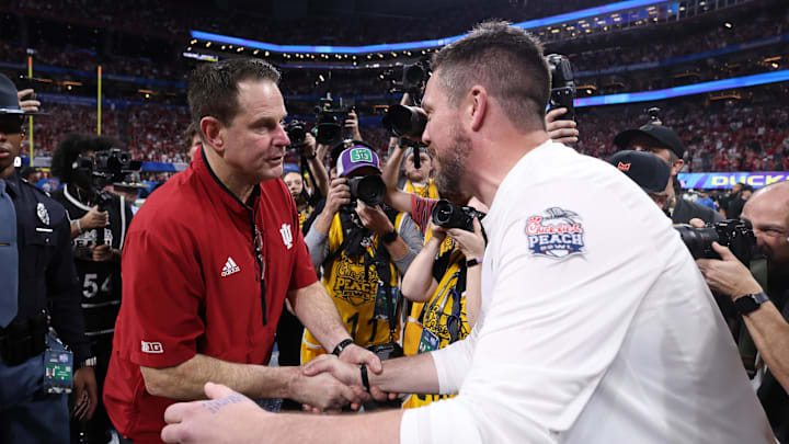 Jan 9, 2026; Atlanta, GA, USA; Indiana Hoosiers head coach Curt Cignetti and Oregon Ducks head coach Dan Lanning shake hands after the 2025 Peach Bowl and semifinal game of the College Football Playoff at Mercedes-Benz Stadium. Mandatory Credit: Brett Davis-Imagn Images