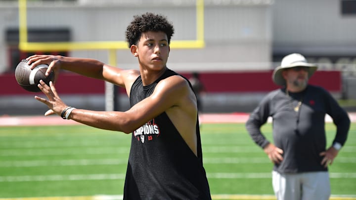 quarterback Davin Davidson passes the ball during 7-on-7 drills. Cardinal Mooney High football players participate in the school's summer strength and conditioning camp Monday, July 22, 2024. The Cougars won the FHSAA Class 1S state championship last year, defeating Trinity Catholic.