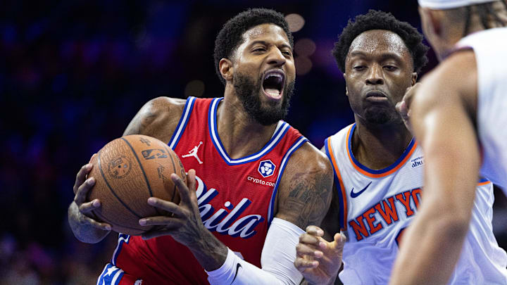Nov 12, 2024; Philadelphia, Pennsylvania, USA; Philadelphia 76ers forward Paul George (8) drives against New York Knicks forward OG Anunoby (8) during the third quarter at Wells Fargo Center. Mandatory Credit: Bill Streicher-Imagn Images