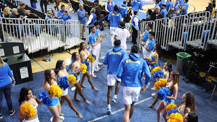 Jan 21, 2025; Los Angeles, California, USA;  UCLA Bruins players enter the court before a game against the Wisconsin Badgers at Pauley Pavilion presented by Wescom. Mandatory Credit: Kiyoshi Mio-Imagn Images
