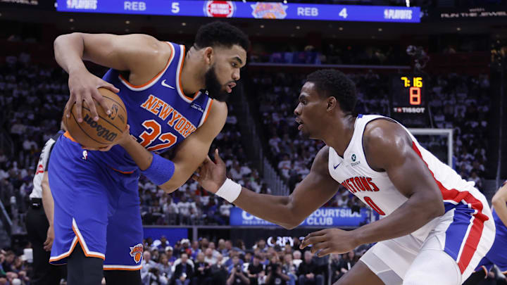 May 1, 2025; Detroit, Michigan, USA; New York Knicks center Karl-Anthony Towns (32) is defended by Detroit Pistons center Jalen Duren (0) in the first half during game six of first round for the 2024 NBA Playoffs at Little Caesars Arena. Mandatory Credit: Rick Osentoski-Imagn Images