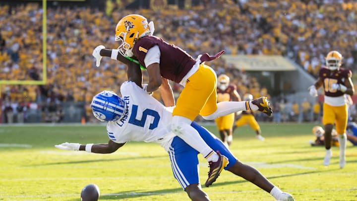 Nov 23, 2024; Tempe, Arizona, USA; Arizona State Sun Devils defensive back Keith Abney II (1) breaks up a pass to Brigham Young Cougars wide receiver Darius Lassiter (5) in the second half at Mountain America Stadium. Mandatory Credit: Mark J. Rebilas-Imagn Images Nov 23, 2024; Tempe, Arizona, USA; Arizona State Sun Devils defensive back Keith Abney II (1) breaks up a pass to Brigham Young Cougars wide receiver Darius Lassiter (5) in the second half at Mountain America Stadium. Mandatory Credit: Mark J. Rebilas-Imagn Images