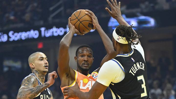 Nov 17, 2025; Cleveland, Ohio, USA; Milwaukee Bucks forward Kyle Kuzma (18) and center Myles Turner (3) defend Cleveland Cavaliers center Evan Mobley (4) in the first quarter at Rocket Arena. Mandatory Credit: David Richard-Imagn Images Nov 17, 2025; Cleveland, Ohio, USA; Milwaukee Bucks forward Kyle Kuzma (18) and center Myles Turner (3) defend Cleveland Cavaliers center Evan Mobley (4) in the first quarter at Rocket Arena. Mandatory Credit: David Richard-Imagn Images