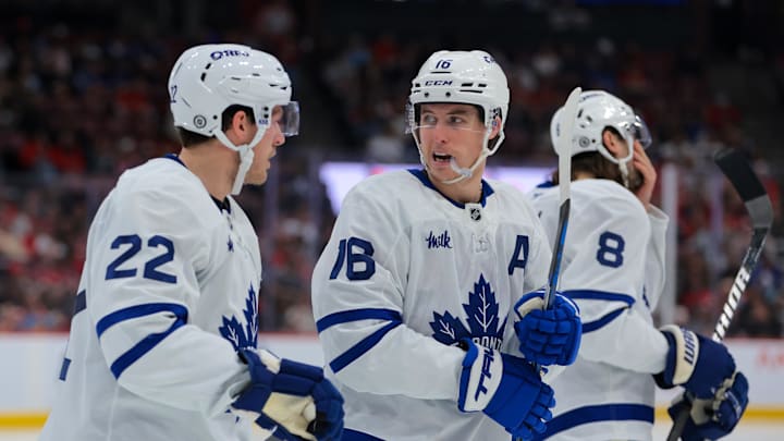 Nov 27, 2024; Sunrise, Florida, USA; Toronto Maple Leafs right wing Mitch Marner (16) talks to defenseman Jake McCabe (22) against the Florida Panthers during the second period at Amerant Bank Arena. Mandatory Credit: Sam Navarro-Imagn Images