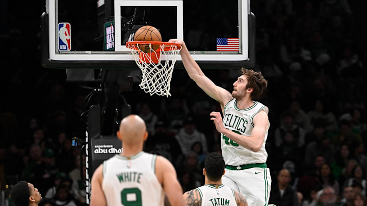 Apr 11, 2025; Boston, Massachusetts, USA; Boston Celtics center Luke Kornet (40) dunks the ball against the Charlotte Hornets during the second half at TD Garden. Mandatory Credit: Eric Canha-Imagn Images