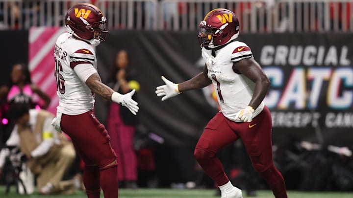 Sep 28, 2025; Atlanta, Georgia, USA; Washington Commanders wide receiver Deebo Samuel Sr. (1) celebrates with running back Chris Rodriguez Jr. (36) after scoring a touchdown during the second half against the Atlanta Falcons at Mercedes-Benz Stadium. Mandatory Credit: Brett Davis-Imagn Images Sep 28, 2025; Atlanta, Georgia, USA; Washington Commanders wide receiver Deebo Samuel Sr. (1) celebrates with running back Chris Rodriguez Jr. (36) after scoring a touchdown during the second half against the Atlanta Falcons at Mercedes-Benz Stadium. Mandatory Credit: Brett Davis-Imagn Images