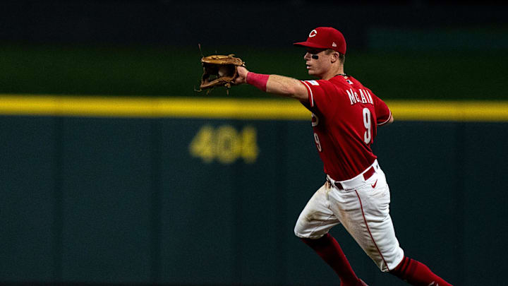 Cincinnati Reds second baseman Matt McLain (9) fields a ground ball before throwing out Cleveland Guardians left fielder Steven Kwan (38) out at first in the eighth inning of the MLB baseball game between the Cincinnati Reds and the Cleveland Guardians at Great American Ball Park in Cincinnati on Wednesday, Aug. 16, 2023.