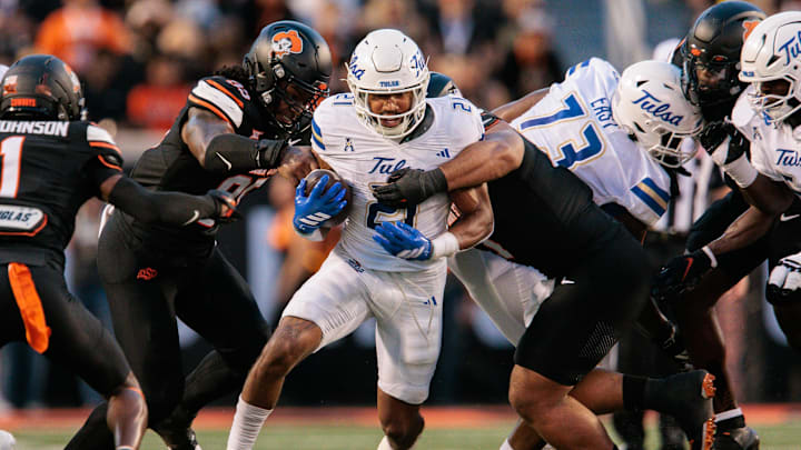 Sep 19, 2025; Stillwater, Oklahoma, USA; Tulsa Golden Hurricane running back Dominic Richardson (21) runs the ball during the first half against the Oklahoma State Cowboys at Boone Pickens Stadium. Mandatory Credit: William Purnell-Imagn Images Sep 19, 2025; Stillwater, Oklahoma, USA; Tulsa Golden Hurricane running back Dominic Richardson (21) runs the ball during the first half against the Oklahoma State Cowboys at Boone Pickens Stadium. Mandatory Credit: William Purnell-Imagn Images