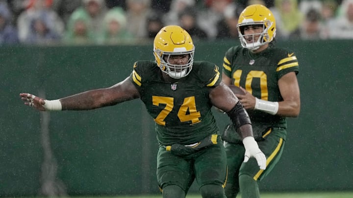 Filling in for injured center Josh Myers, Green Bay Packers guard Elgton Jenkins (74) provides pass protection during the second quarter of their game against Detroit Lions Sunday, November 3, 2024 at Lambeau Field in Green Bay, Wisconsin.