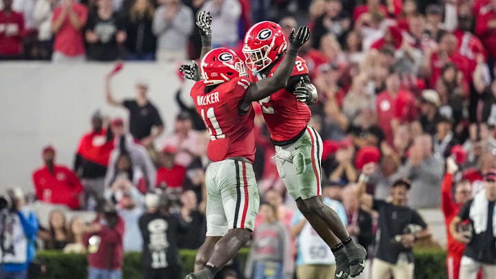 Nov 4, 2023; Athens, Georgia, USA; Georgia Bulldogs linebacker Jalon Walker (11) reacts with linebacker Smael Mondon Jr. (2) after sacking Missouri Tigers quarterback Brady Cook (12) (not shown) during the second half at Sanford Stadium. Mandatory Credit: Dale Zanine-Imagn Images