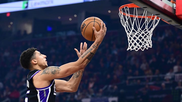 Jan 23, 2026; Cleveland, Ohio, USA; Sacramento Kings guard Nique Clifford (5) drives to the basket against against the Cleveland Cavaliers during the first half at Rocket Arena. Mandatory Credit: Ken Blaze-Imagn Images
