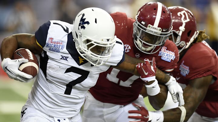 Aug 30, 2014; Atlanta, GA, USA; West Virginia Mountaineers running back Rushel Shell (7) runs against Alabama Crimson Tide running back Kenyan Drake (17) on a kick off during the third quarter of the 2014 Chick-fil-a kickoff game at Georgia Dome. Mandatory Credit: John David Mercer-Imagn Images Aug 30, 2014; Atlanta, GA, USA; West Virginia Mountaineers running back Rushel Shell (7) runs against Alabama Crimson Tide running back Kenyan Drake (17) on a kick off during the third quarter of the 2014 Chick-fil-a kickoff game at Georgia Dome. Mandatory Credit: John David Mercer-Imagn Images