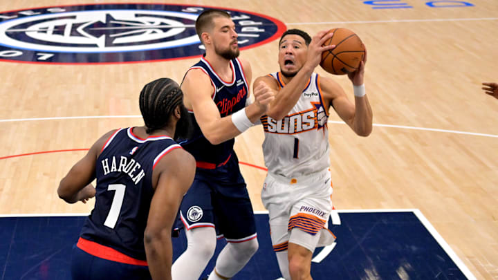 Los Angeles Clippers guard James Harden (1) and center Ivica Zubac (40) defend Phoenix Suns guard Devin Booker (1) in the second half at Intuit Dome. Mandatory Credit: Jayne Kamin-Oncea-Imagn Images Los Angeles Clippers guard James Harden (1) and center Ivica Zubac (40) defend Phoenix Suns guard Devin Booker (1) in the second half at Intuit Dome. Mandatory Credit: Jayne Kamin-Oncea-Imagn Images