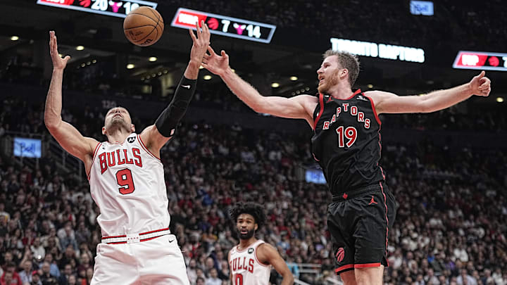 Apr 12, 2023; Toronto, Ontario, CAN; Chicago Bulls center Nikola Vucevic (9) and Toronto Raptors center Jakob Poeltl (19) battle for a rebound during the second half of a NBA Play-In game at Scotiabank Arena. Mandatory Credit: John E. Sokolowski-Imagn Images Apr 12, 2023; Toronto, Ontario, CAN; Chicago Bulls center Nikola Vucevic (9) and Toronto Raptors center Jakob Poeltl (19) battle for a rebound during the second half of a NBA Play-In game at Scotiabank Arena. Mandatory Credit: John E. Sokolowski-Imagn Images