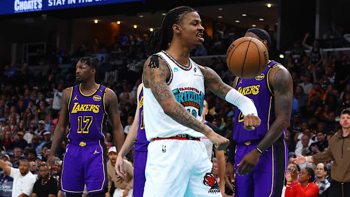 Mar 29, 2025; Memphis, Tennessee, USA; Memphis Grizzlies guard Ja Morant (12) reacts after a basket during the third quarter against the Los Angeles Lakers at FedExForum. Mandatory Credit: Petre Thomas-Imagn Images