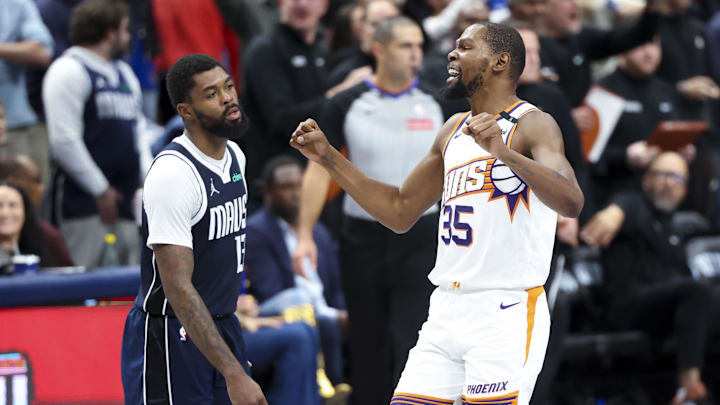 Nov 8, 2024; Dallas, Texas, USA;  Phoenix Suns forward Kevin Durant (35) reacts in front of Dallas Mavericks forward Naji Marshall (13) during the fourth quarter at American Airlines Center. Mandatory Credit: Kevin Jairaj-Imagn Images