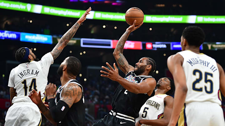 Mar 25, 2023; Los Angeles, California, USA; Los Angeles Clippers forward Kawhi Leonard (2) shoots against New Orleans Pelicans forward Brandon Ingram (14) during the second half at Crypto.com Arena. Mandatory Credit: Gary A. Vasquez-Imagn Images
