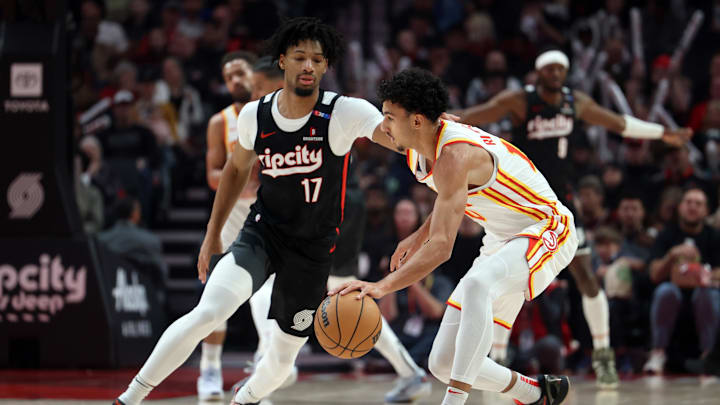 Nov 17, 2024; Portland, Oregon, USA; Portland Trail Blazers guard Shaedon Sharpe (17) defends Atlanta Hawks forward Zaccharie Risacher (10)  in the first half at Moda Center. Mandatory Credit: Jaime Valdez-Imagn Images