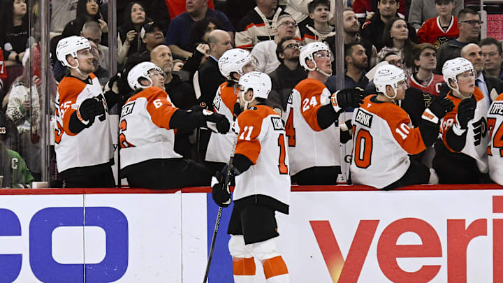 Dec 23, 2025; Chicago, Illinois, USA;  Philadelphia Flyers right wing Travis Konecny (11) celebrates with teammates after scoring against the Chicago Blackhawks during the first period at United Center. Mandatory Credit: Matt Marton-Imagn Images