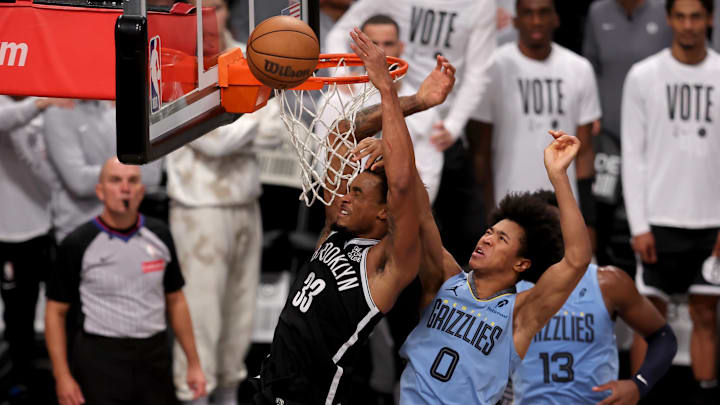 Nov 4, 2024; Brooklyn, New York, USA; Brooklyn Nets center Nic Claxton (33) misses a shot defended by Memphis Grizzlies forward Jaylen Wells (0) during the fourth quarter at Barclays Center. Mandatory Credit: Brad Penner-Imagn Images