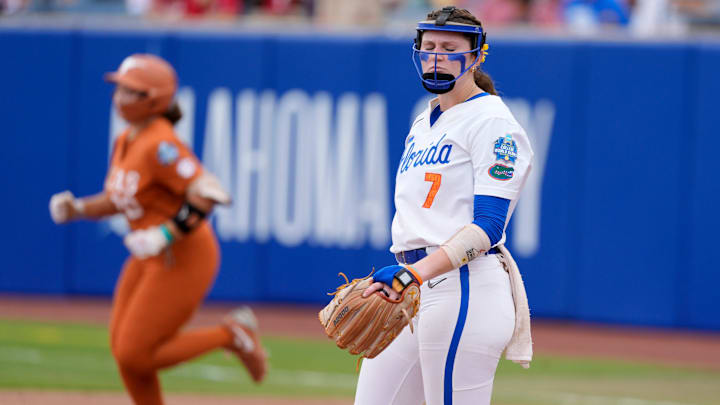Florida pitcher Keagan Rothrock (7) reacts after giving up a home run to Texas utility Katie Stewart (20) in the sixth inning of a Women's College World Series softball game between the Texas Longhorns and the Florida Gators at Devon Park in Oklahoma City, Thursday, May 29, 2025.