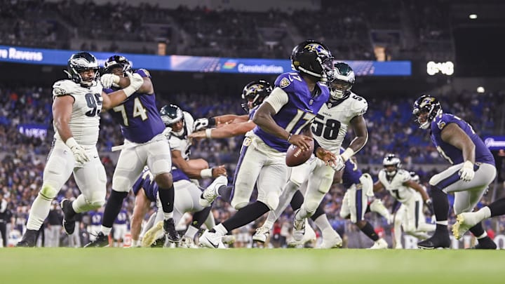 Baltimore Ravens quarterback Josh Johnson (17) rolls out to pass as Philadelphia Eagles linebacker Jalyx Hunt (58) applies pressure. Baltimore Ravens quarterback Josh Johnson (17) rolls out to pass as Philadelphia Eagles linebacker Jalyx Hunt (58) applies pressure.