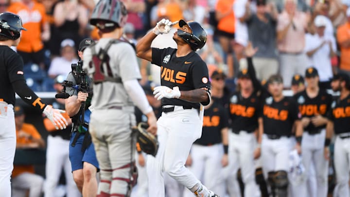 Tennessee's Christian Moore (1) celebrates while running the bases after hitting a home run during game three of the NCAA College World Series finals between Tennessee and Texas A&M at Charles Schwab Field in Omaha, Neb., on Monday, June 24, 2024.