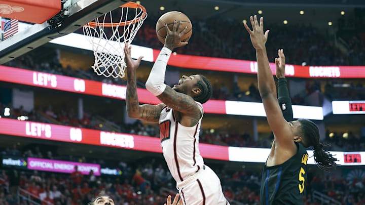 May 4, 2025; Houston, Texas, USA; Golden State Warriors forward Kevon Looney (5) defends as Houston Rockets guard Jalen Green (4) attempts to score during game seven of the first round for the 2025 NBA Playoffs at Toyota Center. Mandatory Credit: Troy Taormina-Imagn Images May 4, 2025; Houston, Texas, USA; Golden State Warriors forward Kevon Looney (5) defends as Houston Rockets guard Jalen Green (4) attempts to score during game seven of the first round for the 2025 NBA Playoffs at Toyota Center. Mandatory Credit: Troy Taormina-Imagn Images