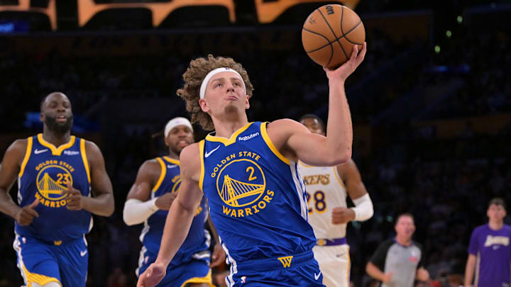 Oct 12, 2025; Los Angeles, California, USA;  Golden State Warriors guard Brandin Podziemski (2) drives to the basket during the second half against the Los Angeles Lakers at Crypto.com Arena. Mandatory Credit: Jayne Kamin-Oncea-Imagn Images