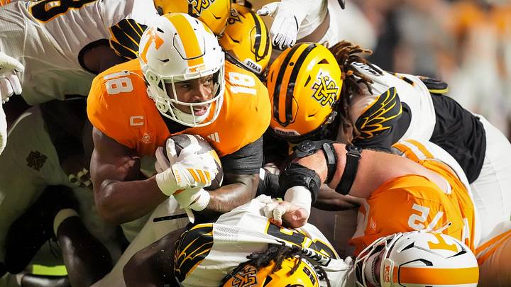 Tennessee running back DeSean Bishop (18) is swarmed by Kennesaw State defenders during Tennessee’s college football game against Kennesaw State at Neyland Stadium in Knoxville on Sept. 19, 2026.