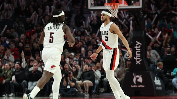 Mar 10, 2026; Portland, Oregon, USA; Portland Trail Blazers forward Toumani Camara (33) runs back on defense with guard Jrue Holiday (5) against the Charlotte Hornets during the second half at Moda Center. Mandatory Credit: Jaime Valdez-Imagn Images Mar 10, 2026; Portland, Oregon, USA; Portland Trail Blazers forward Toumani Camara (33) runs back on defense with guard Jrue Holiday (5) against the Charlotte Hornets during the second half at Moda Center. Mandatory Credit: Jaime Valdez-Imagn Images