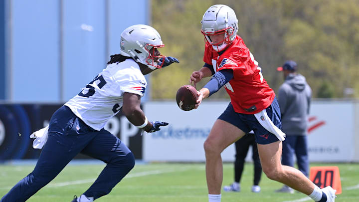 May 11, 2024; Foxborough, MA, USA; New England Patriots quarterback Drake Maye (10) hands the ball