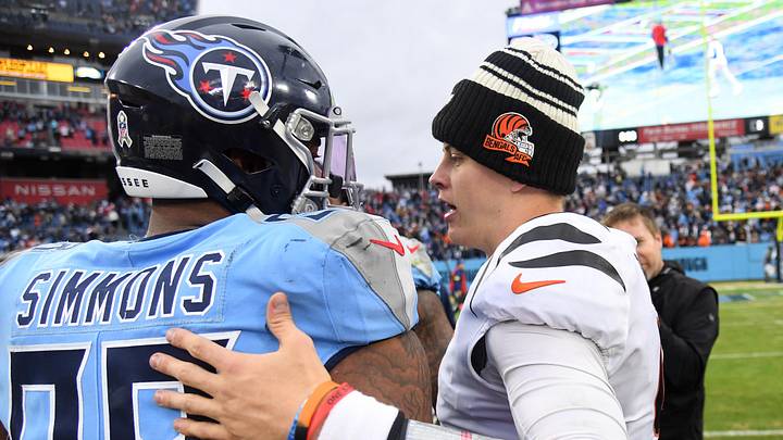 Nov 27, 2022; Nashville, Tennessee, USA; Tennessee Titans defensive tackle Jeffery Simmons (98) and Cincinnati Bengals quarterback Joe Burrow (9) after a Bengals win at Nissan Stadium. Mandatory Credit: Christopher Hanewinckel-Imagn Images