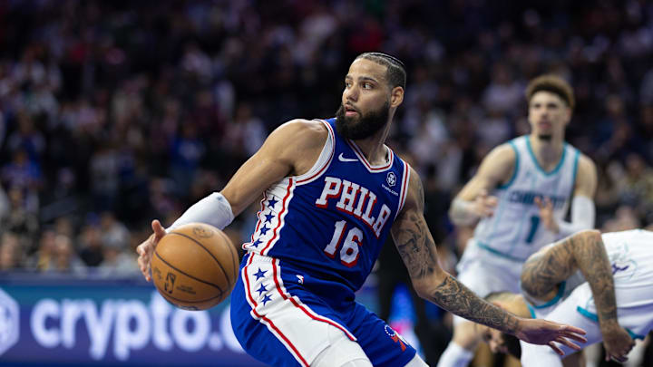 Nov 10, 2024; Philadelphia, Pennsylvania, USA; Philadelphia 76ers forward Caleb Martin (16) picks up a loose ball against the Charlotte Hornets in overtime at Wells Fargo Center. Mandatory Credit: Bill Streicher-Imagn Images