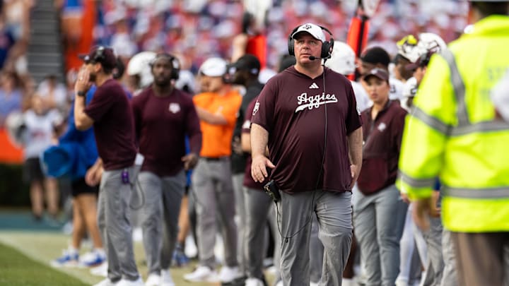 Sep 14, 2024; Gainesville, Florida, USA; Texas A&M Aggies head coach Mike Elko walks the sideline against the Florida Gators during the first half at Ben Hill Griffin Stadium. Mandatory Credit: Matt Pendleton-Imagn Images