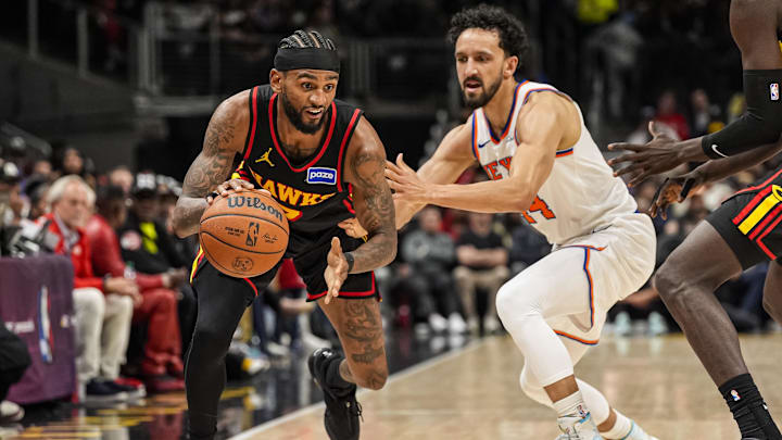 Apr 6, 2026; Atlanta, Georgia, USA; Atlanta Hawks guard Nickeil Alexander-Walker (7) dribbles past New York Knicks guard Landry Shamet (44) during the second half at State Farm Arena. Mandatory Credit: Dale Zanine-Imagn Images