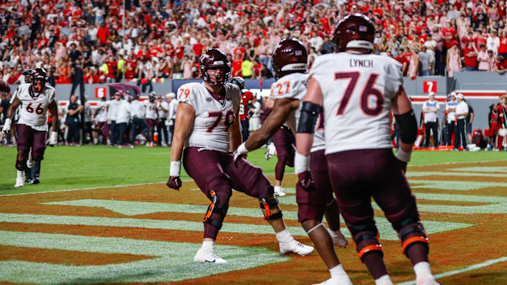 Sep 27, 2025; Raleigh, N.C.; Virginia Tech running back Marcellous Hawkins (27) makes a touchdown and celebrates with offensive lineman Johnny Garrett (79).