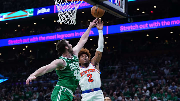 Oct 22, 2024; Boston, Massachusetts, USA; New York Knicks guard Miles McBride (2) shoots against Boston Celtics center Luke Kornet (40) in the second half at TD Garden. Mandatory Credit: David Butler II-Imagn Images