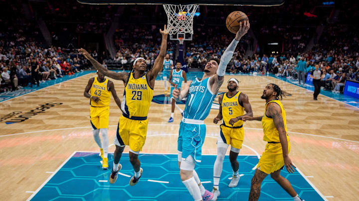 Nov 8, 2024; Charlotte, North Carolina, USA; Charlotte Hornets guard LaMelo Ball (1) shoots against Indiana Pacers guard Quenton Jackson (29) during the second quarter at Spectrum Center. Mandatory Credit: Scott Kinser-Imagn Images