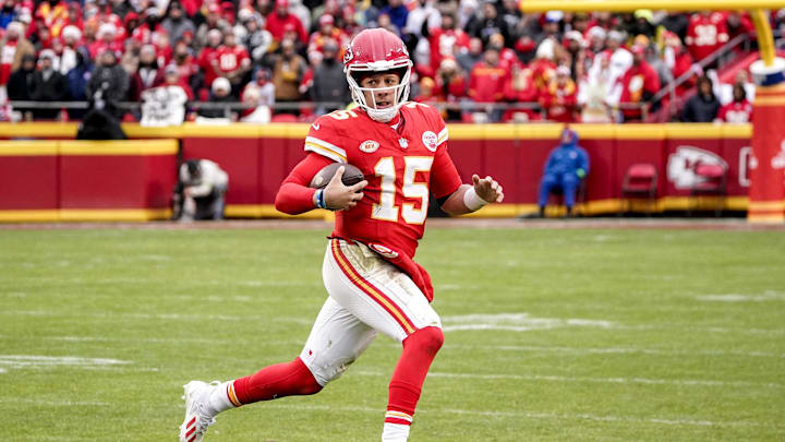 Dec 25, 2023; Kansas City, Missouri, USA; Kansas City Chiefs quarterback Patrick Mahomes (15) runs the ball against the Las Vegas Raiders during the second half at GEHA Field at Arrowhead Stadium. Mandatory Credit: Denny Medley-Imagn Images