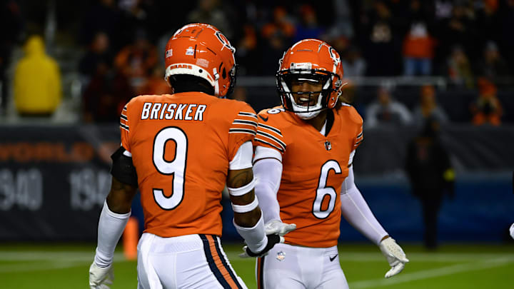 Oct 13, 2022; Chicago, Illinois, USA; Chicago Bears safety Jaquan Brisker (9) and Chicago Bears cornerback Kyler Gordon (6) after Brisker sacked Washington Commanders quarterback Carson Wentz (11) during the first half at Soldier Field. Mandatory Credit: Matt Marton-Imagn Images