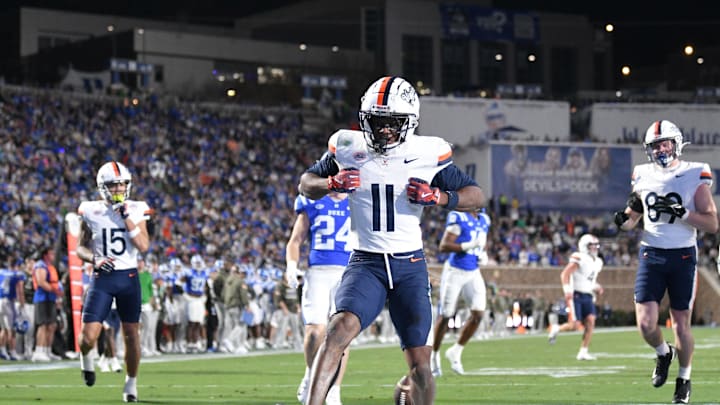 Nov 15, 2025; Durham, North Carolina, USA;  Virginia Cavaliers wide receiver Trell Harris (11) celebrates a touchdown against the Duke Blue Devils in the third quarter at Wallace Wade Stadium. Mandatory Credit: Zachary Taft-Imagn Images