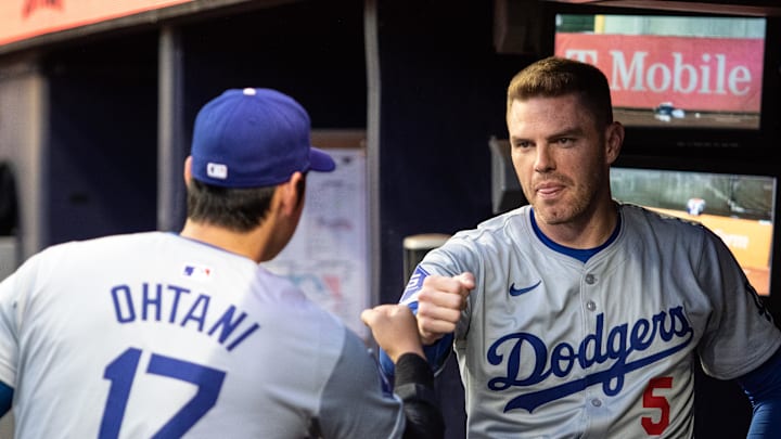 Sep 14, 2024; Cumberland, Georgia, USA; Los Angeles Dodgers two-way player Shohei Ohtani (17) and first base Freddie Freeman (5) fist bump before the game against Atlanta Braves at Truist Park. Mandatory Credit: Jordan Godfree-Imagn Images Sep 14, 2024; Cumberland, Georgia, USA; Los Angeles Dodgers two-way player Shohei Ohtani (17) and first base Freddie Freeman (5) fist bump before the game against Atlanta Braves at Truist Park. Mandatory Credit: Jordan Godfree-Imagn Images