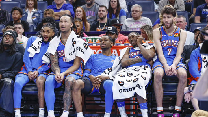 Apr 10, 2024; Oklahoma City, Oklahoma, USA; (L-R) Oklahoma City Thunder guard Isaiah Joe (11) and forward Jaylin Williams (6) and guard Shai Gilgeous-Alexander (2) and forward Jalen Williams (8) and forward Chet Holmgren (7) watch their team play against the San Antonio Spurs during the second half at Paycom Center. Mandatory Credit: Alonzo Adams-USA TODAY Sports