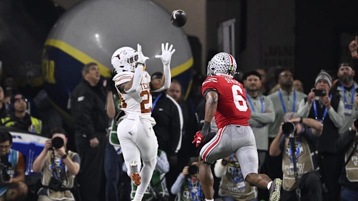 Jan 10, 2025; Arlington, Texas, USA; Texas Longhorns running back Jaydon Blue (23) catches a touchdown against Ohio State Buckeyes safety Sonny Styles (6) during the second quarter of the College Football Playoff semifinal in the Cotton Bowl at AT&T Stadium. Mandatory Credit: Jerome Miron-USA TODAY Sports