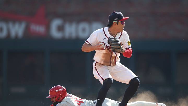 Sep 30, 2026; Cumberland, Georgia, USA;  Atlanta Braves shortstop Ha-Seong Kim (7) makes a play to get out Philadelphia Phillies pinch runner Derek Hill (49) at second base in the ninth inning during game two of the Wildcard round for the 2026 MLB Playoffs at Truist Park.  Mandatory Credit: Brett Davis-Imagn Images