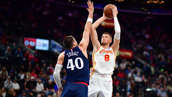 Nov 10, 2025; Inglewood, California, USA; Atlanta Hawks center Kristaps Porzingis (8) shoots against Los Angeles Clippers center Ivica Zubac (40) during the second half at Intuit Dome. Mandatory Credit: Gary A. Vasquez-Imagn Images