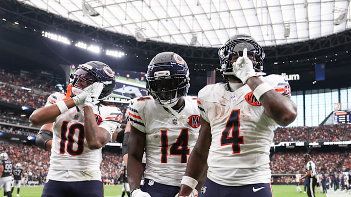 D'Andre Swift (4) celebrates a touchdown with wide receiver Olamide Zaccheaus (14) and Luther Burden III last week. The offense is starting to click, and now they get to sit for a week.